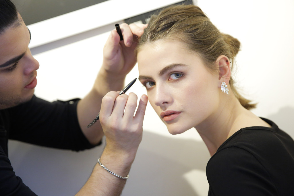 NEW YORK, NY - OCTOBER 09: Model Elle Rigby has her makeup done backstage at the Alon Livne White 2017 Bridal Collection at the Bohemian Benevolent and Literary Association on October 9, 2016 in New York City. (Photo by JP Yim/Getty Images for ALON LIVNE)